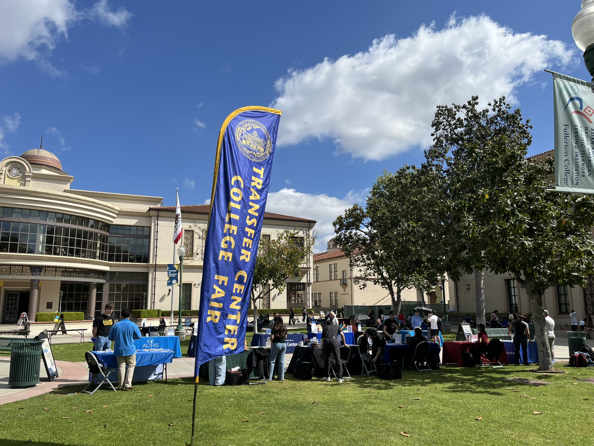 Photo of college fair banner on the quad